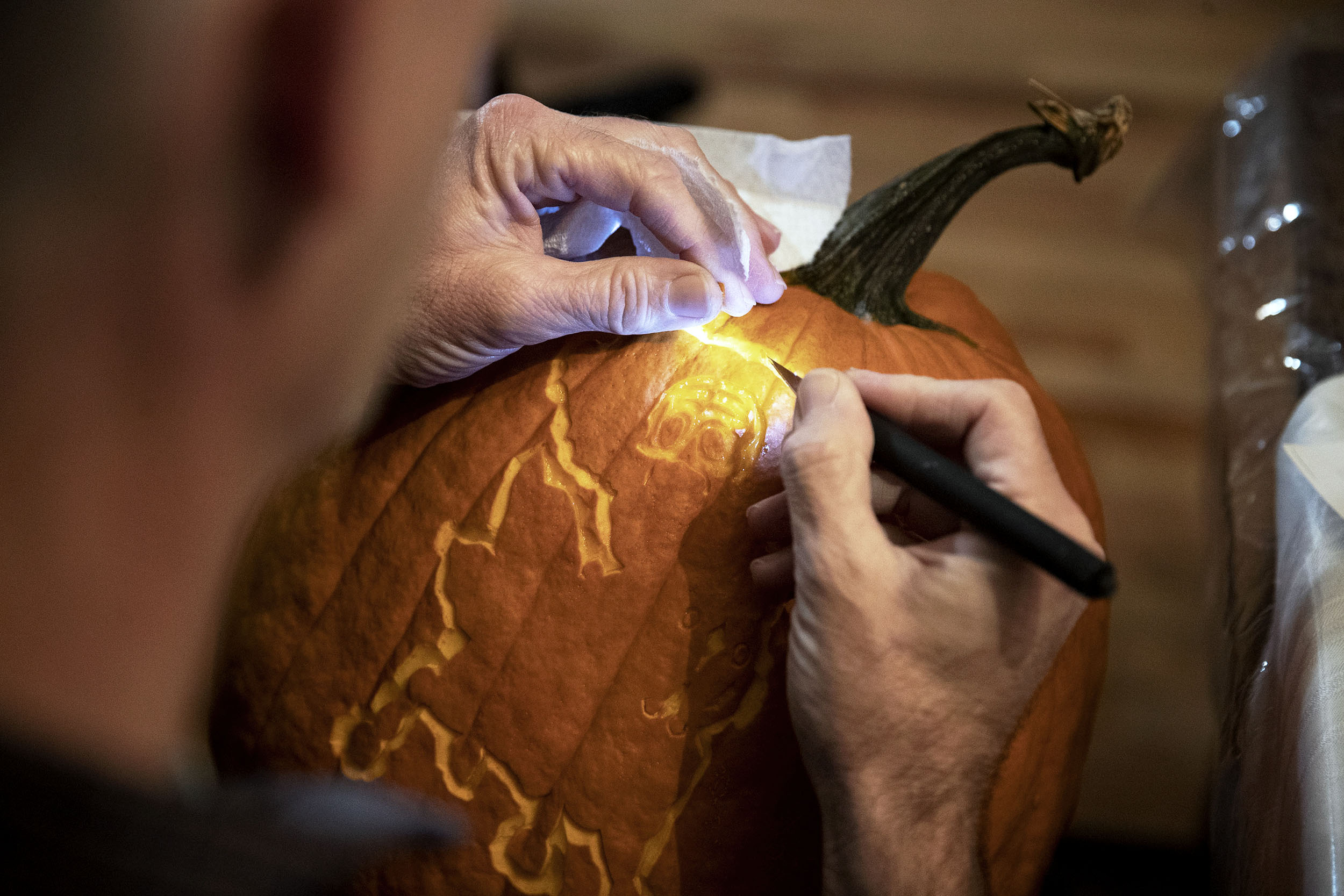 Morton carving a pumpkin
