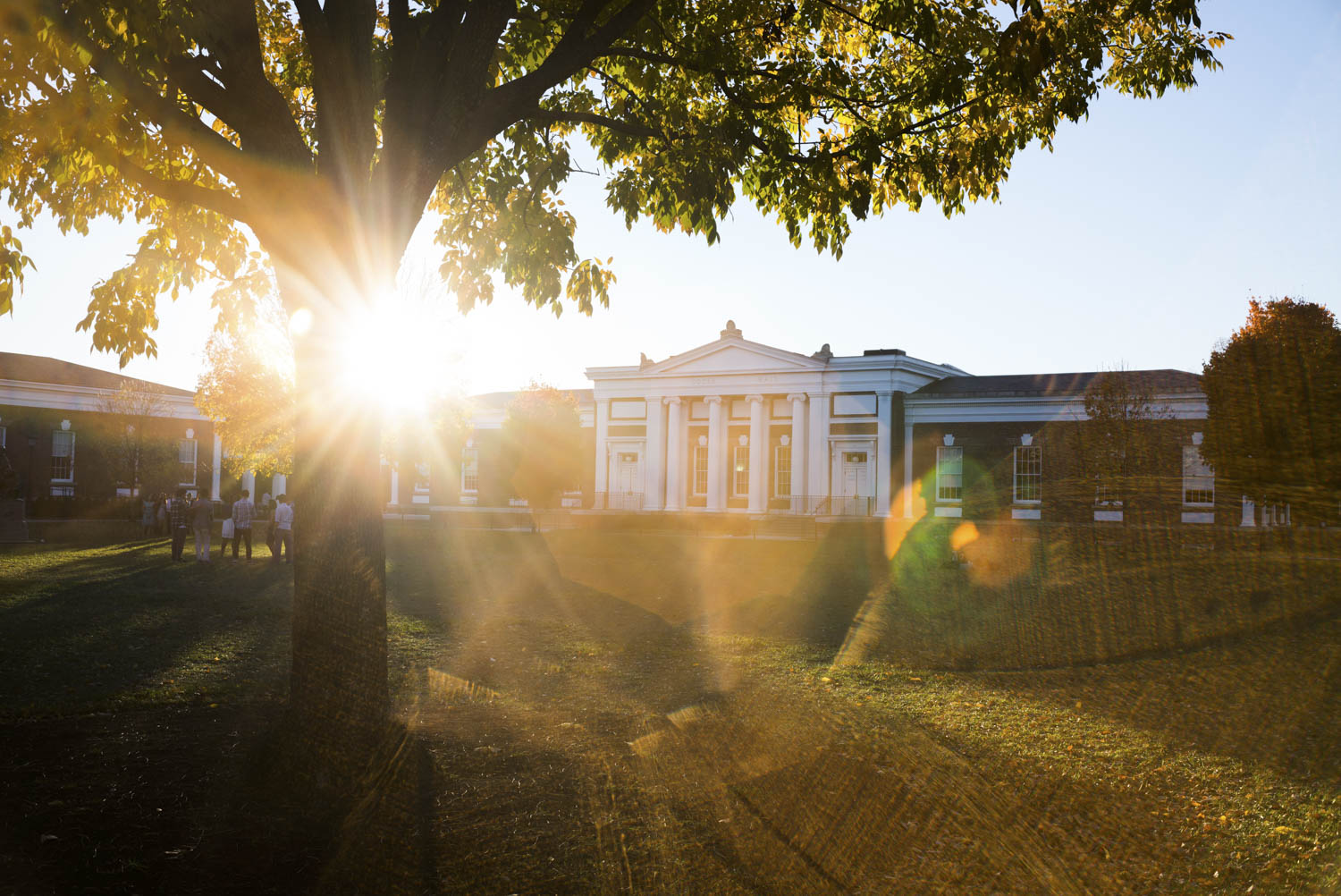 UVA building with the sun shining over the building