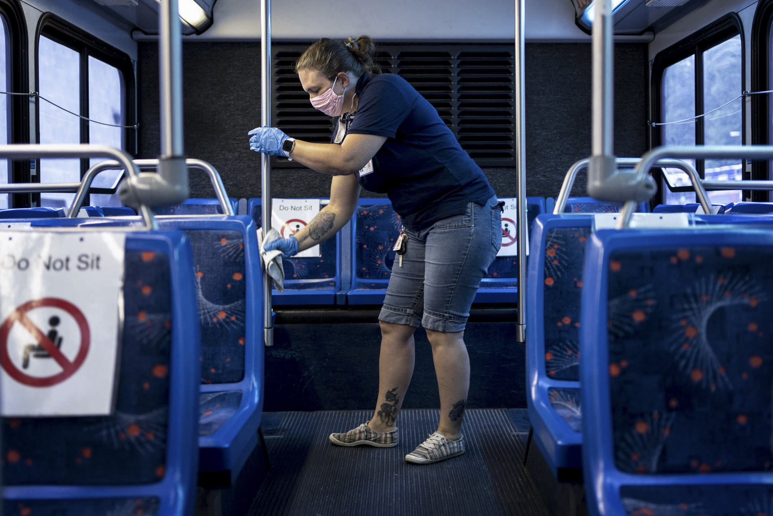Lorelei Miano disinfects a bus