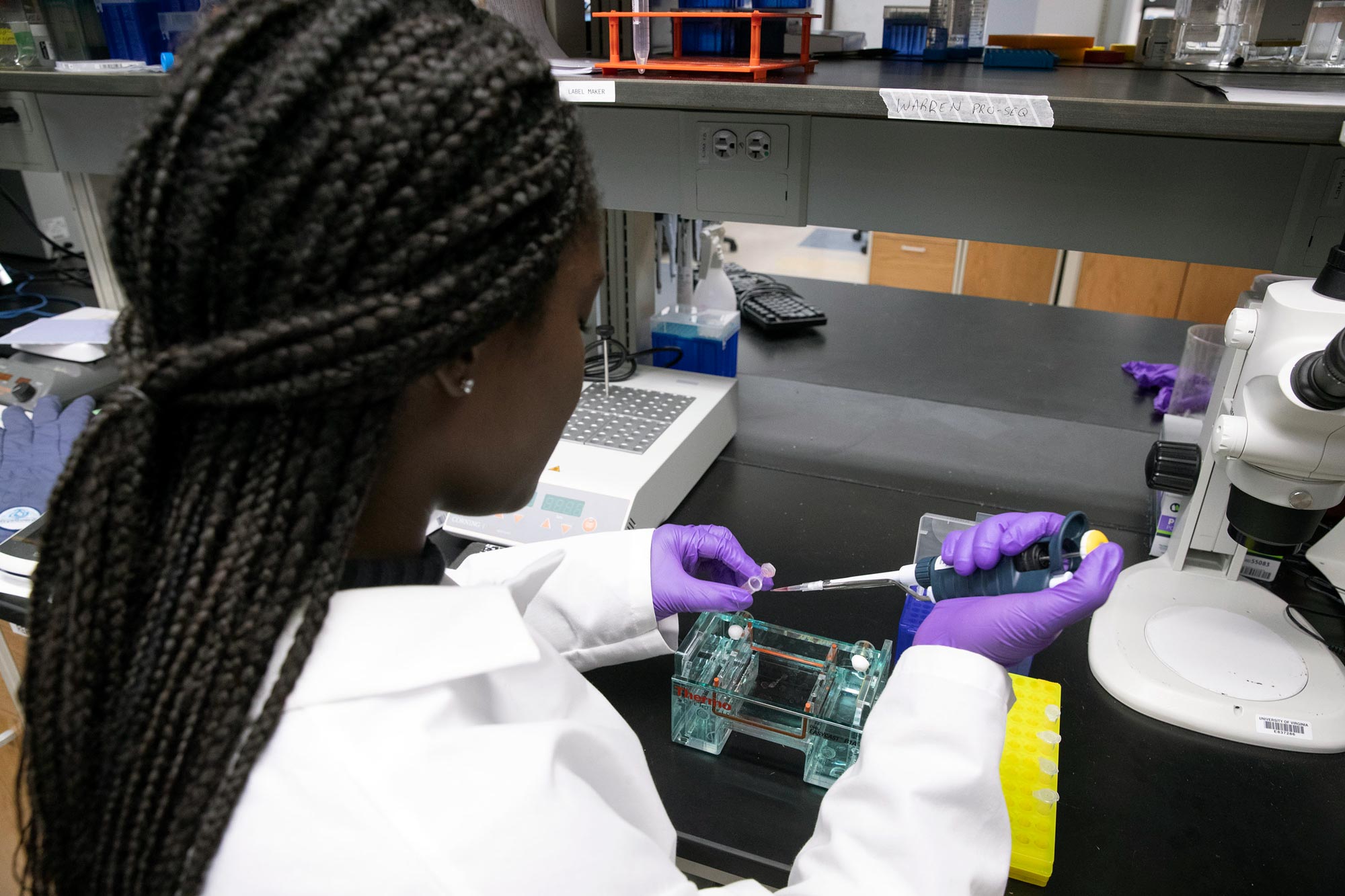 Anane-Wae using a pipet to place sample in test tube