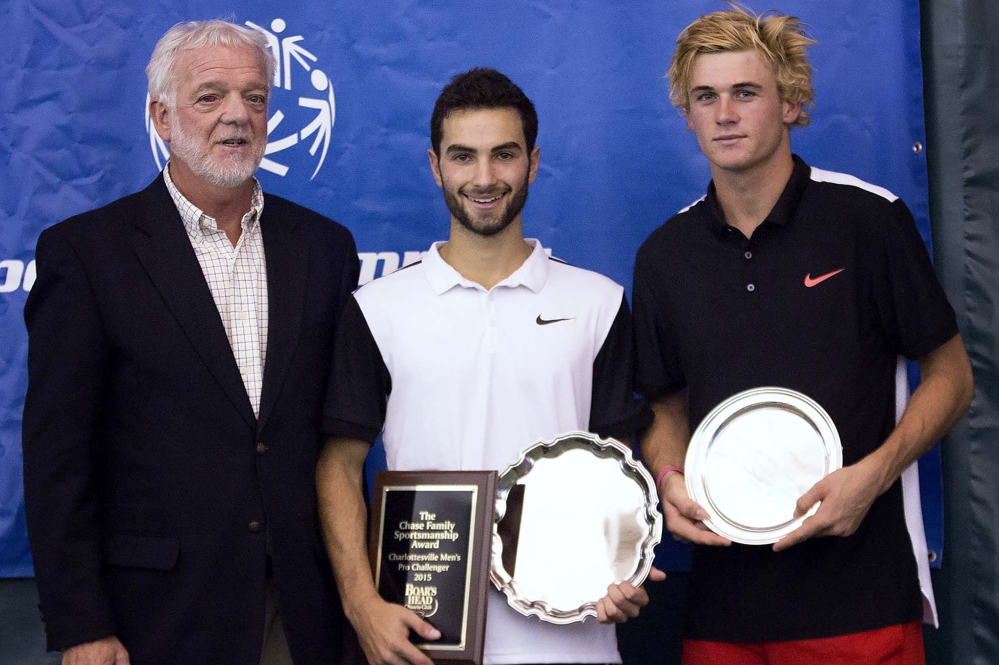 Manilla, left, stands with Noah Rubin and Tommy Paul