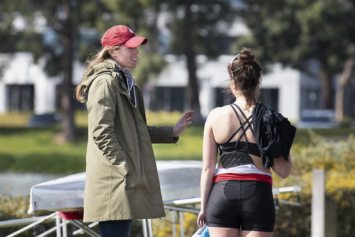 Chaudoin talking to a rowing team member