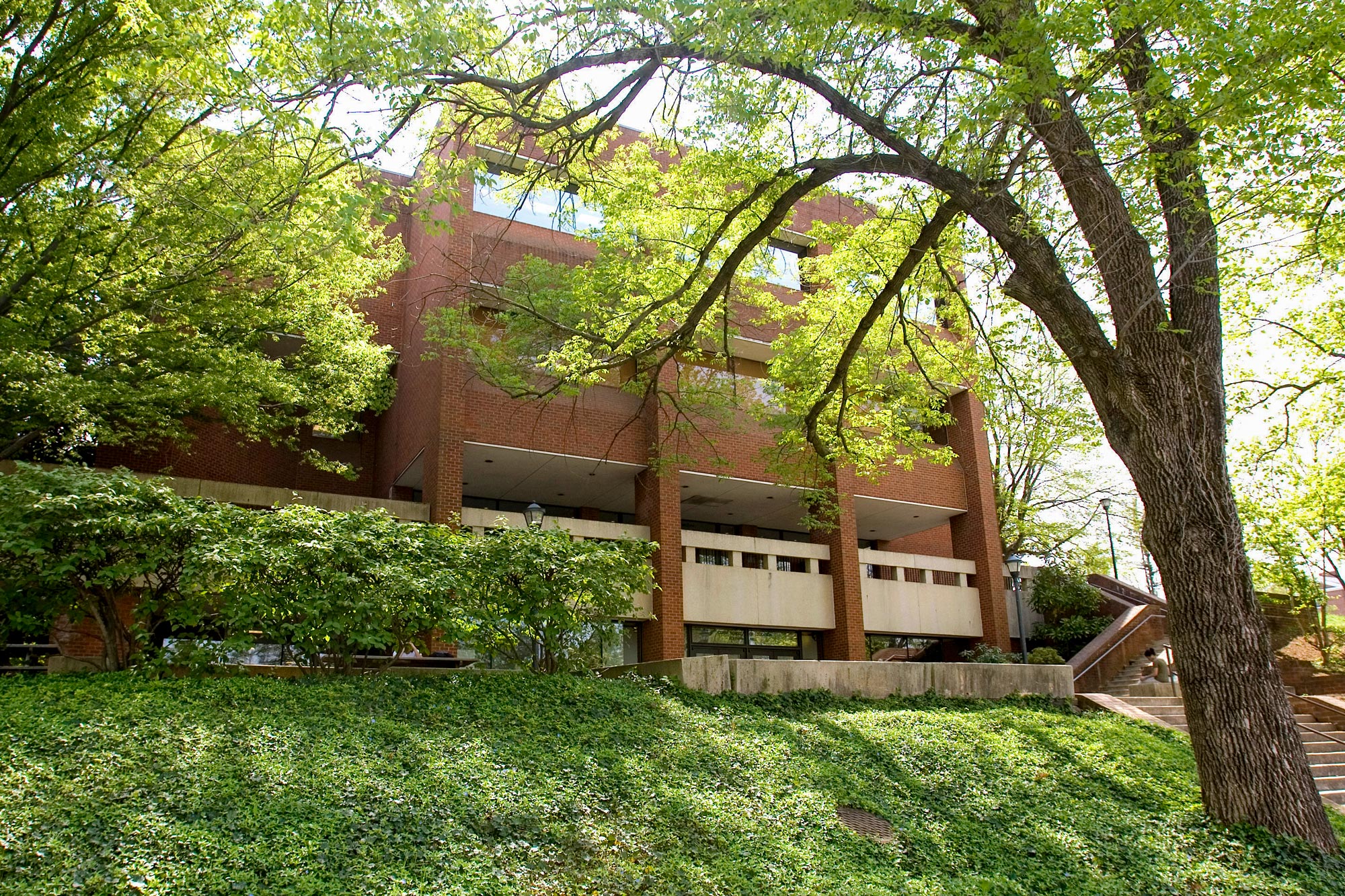 Ridley Hall surrounded by trees and bushes