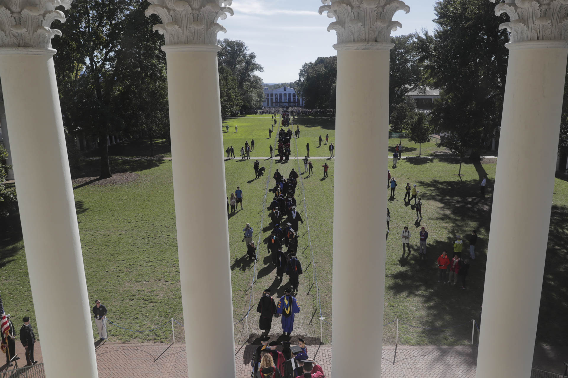 Procession of people walking out of the Rotunda to Old Cabell Hall