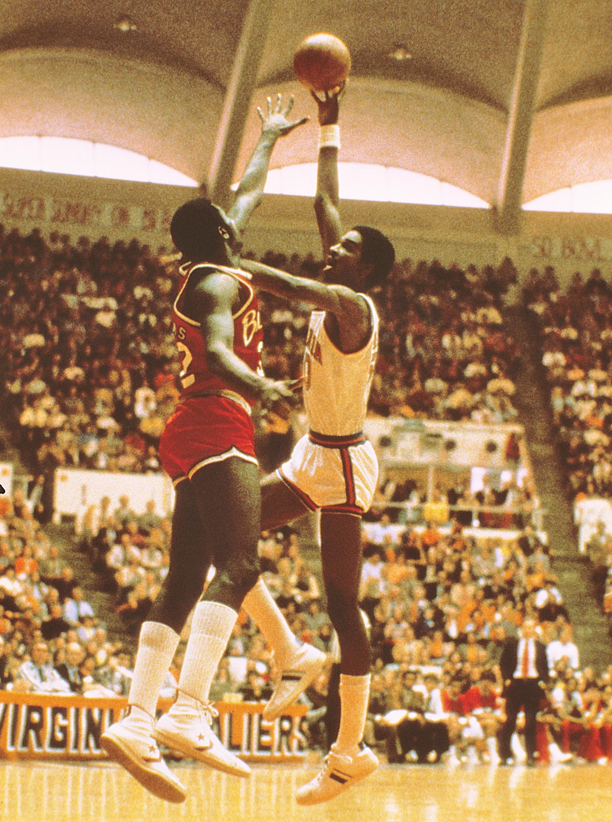Sampson, right, protecting the basketball from an opponent