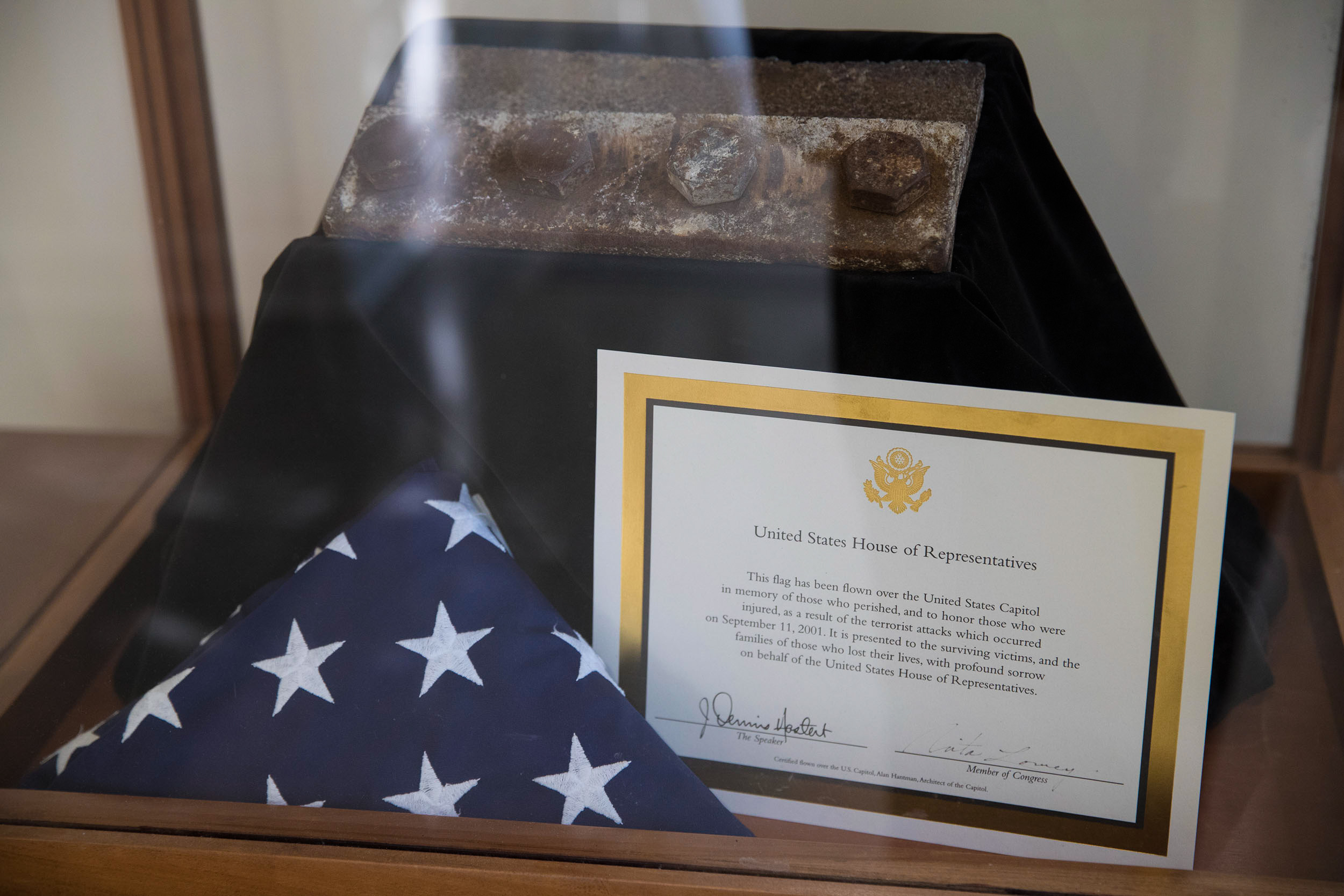 US Flag in a triangle, a piece of steel from the twin towers, and a certificate