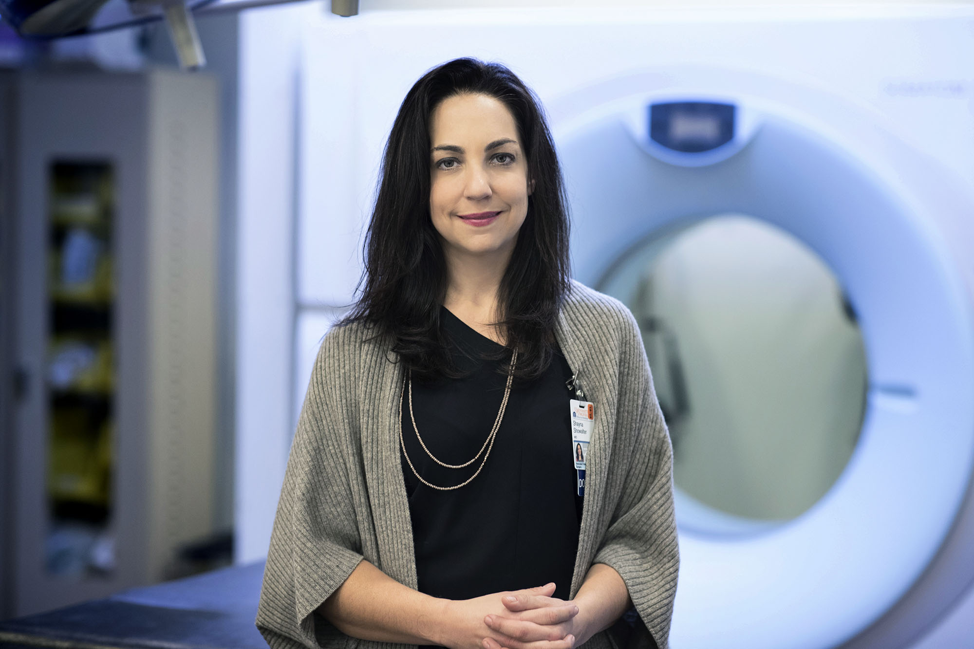 Dr. Shayna L. Showalter headshot in front of an MRI machine