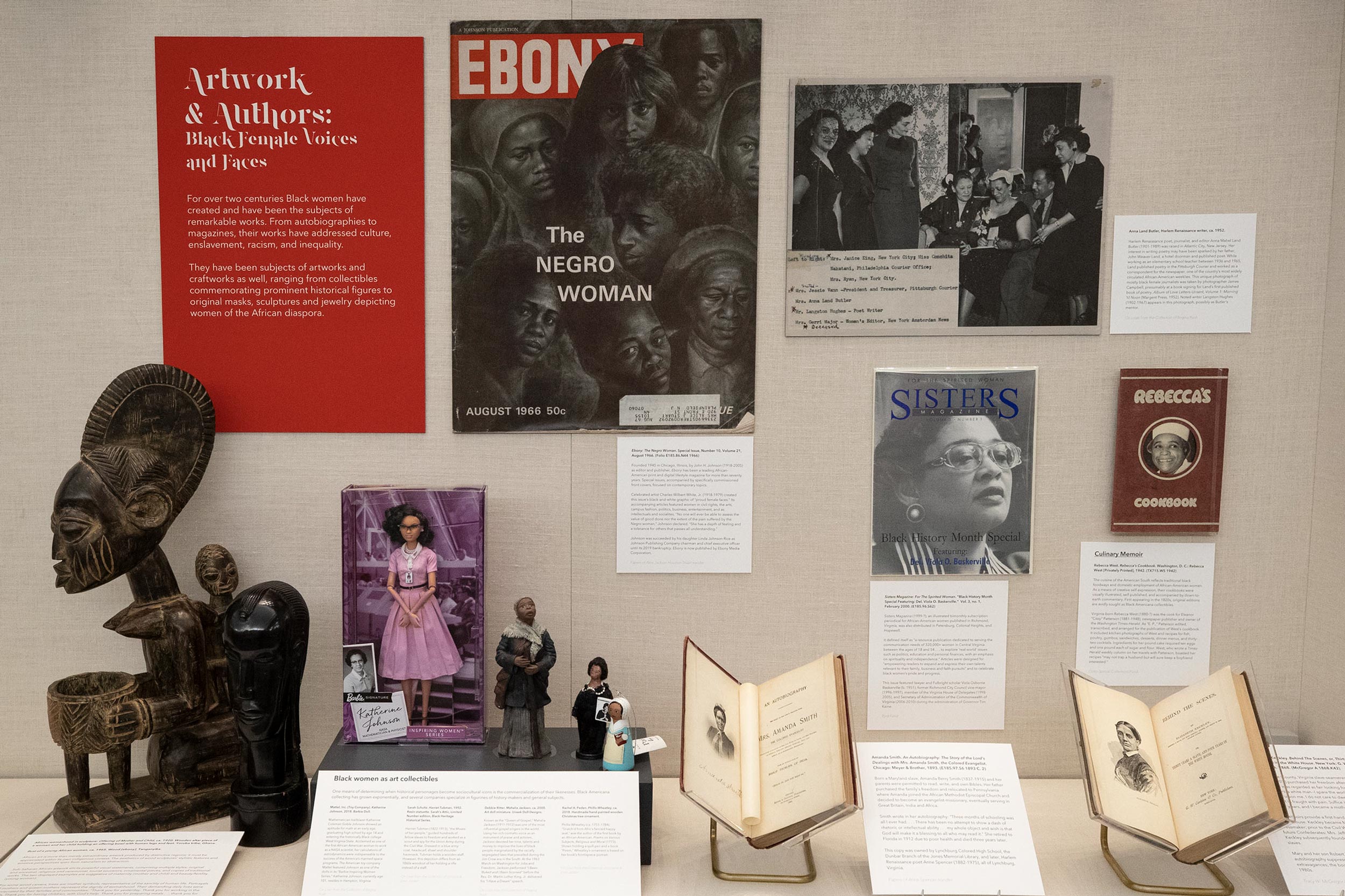 Among the images of black women, curators Ervin Jordan and Regina Rush loaned some of their own collectible items, from African sculptures to ornamental dolls.