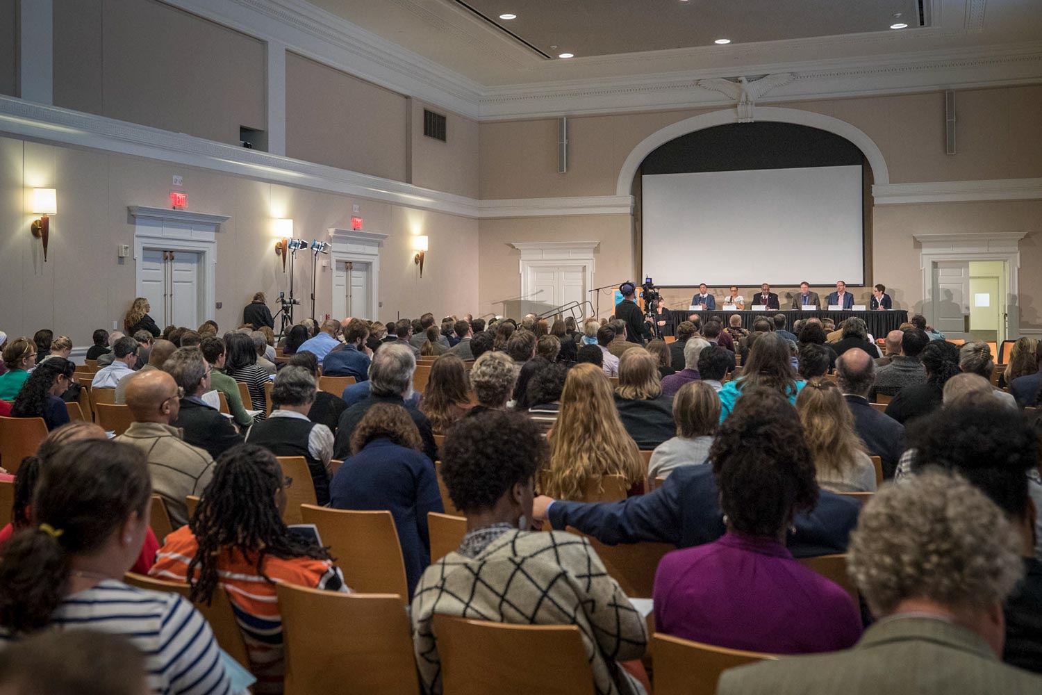 audience listening to a panel discussion