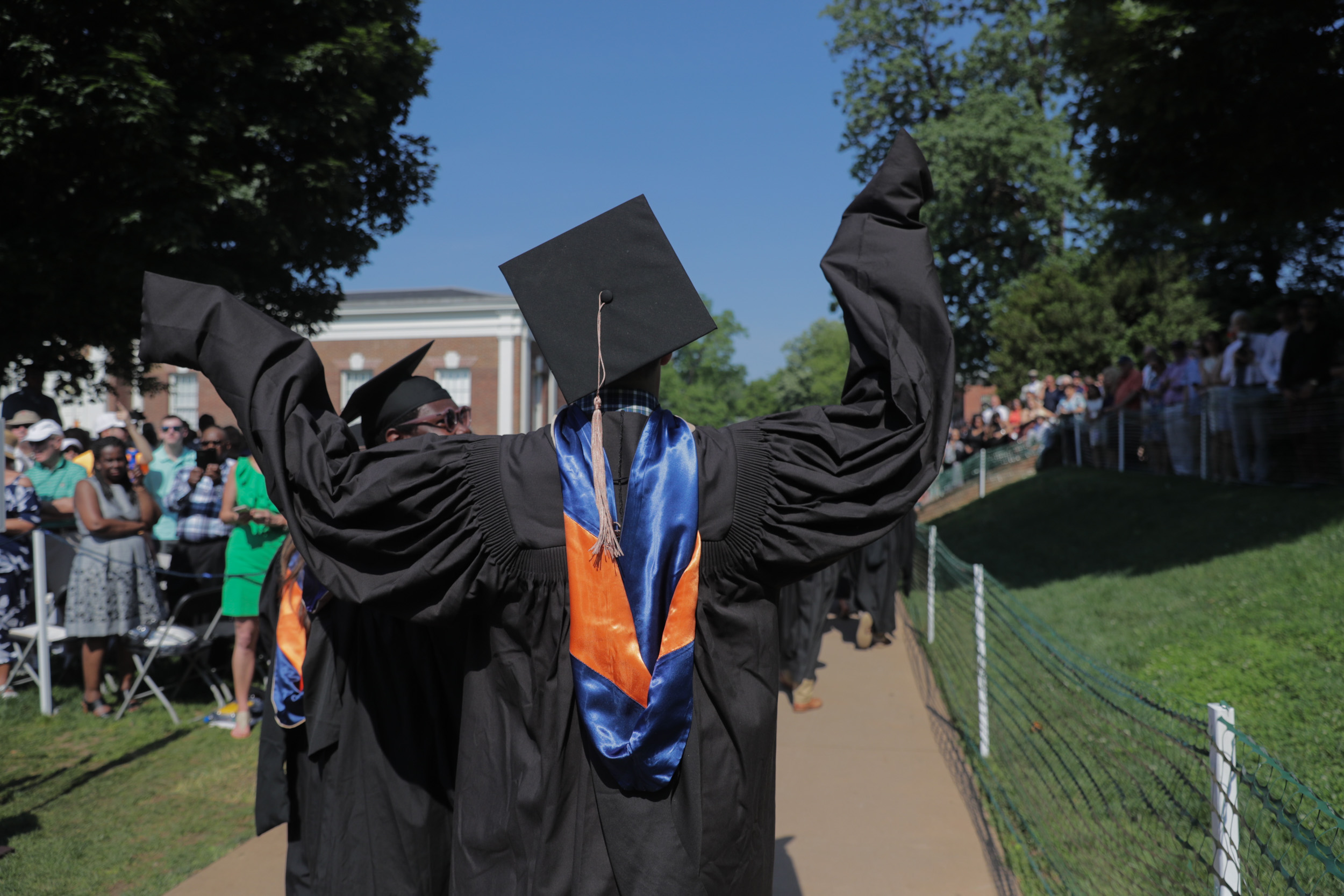 Graduates walking into their graduation