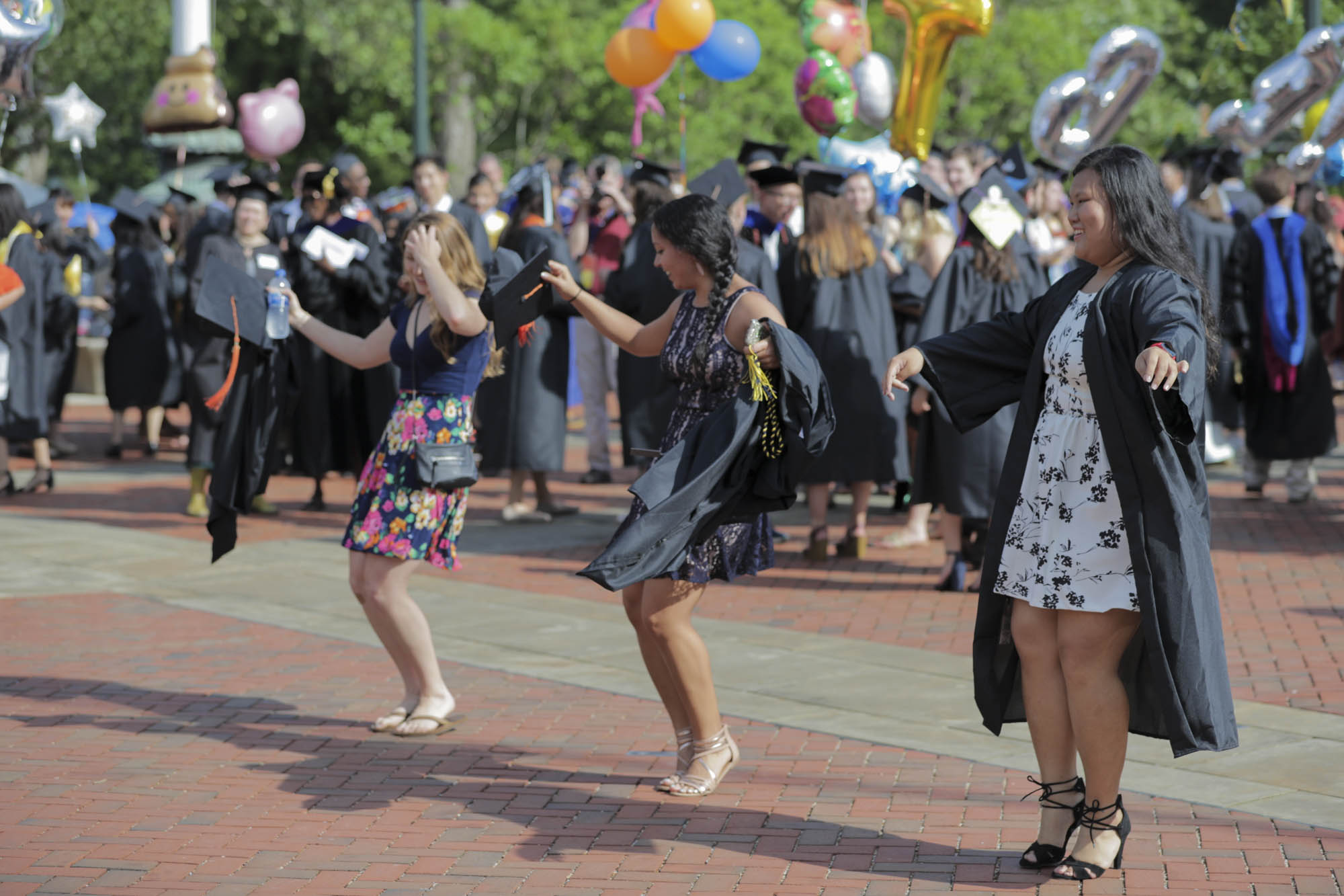 Graduates dancing