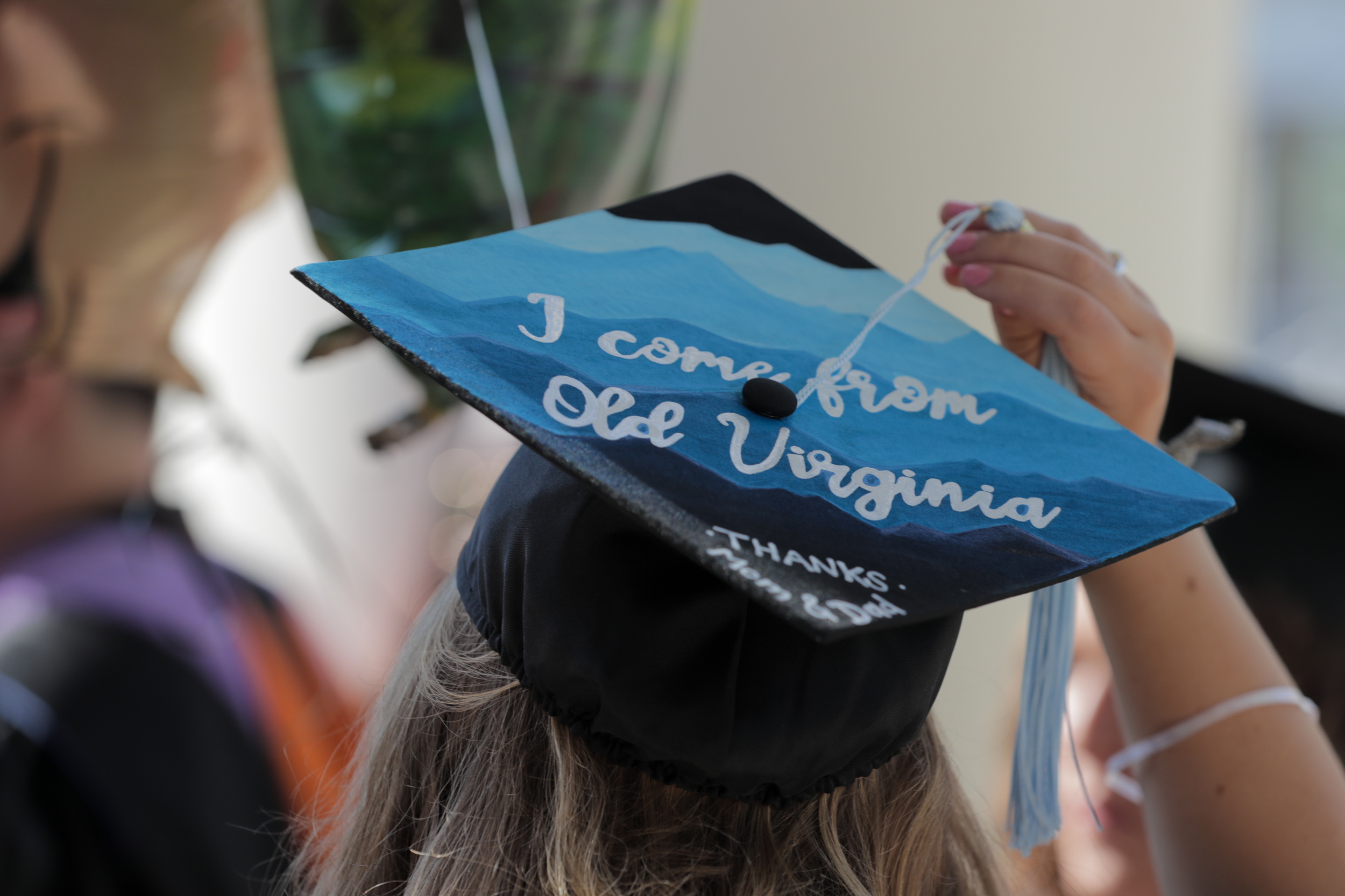 Graduation cap that reads, I come form Hold Virginia Thanks mom & Dad
