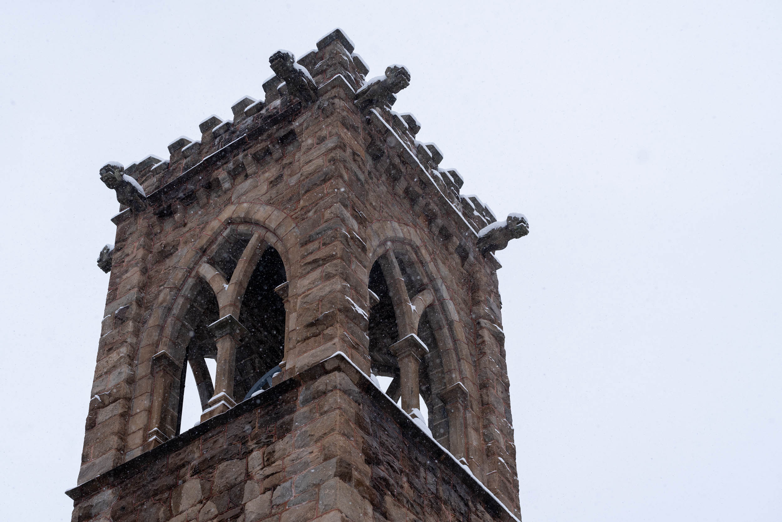 Snow falling on the chapel bell tower