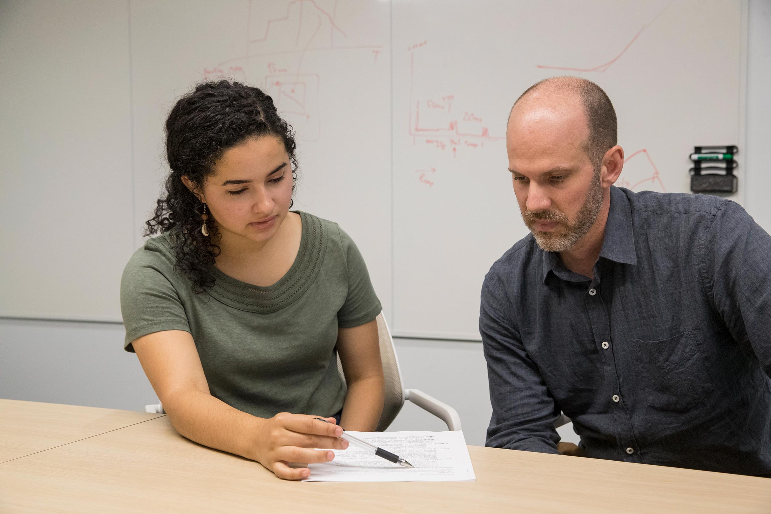 Sophia Keniston and Jon Goodall working together at a table