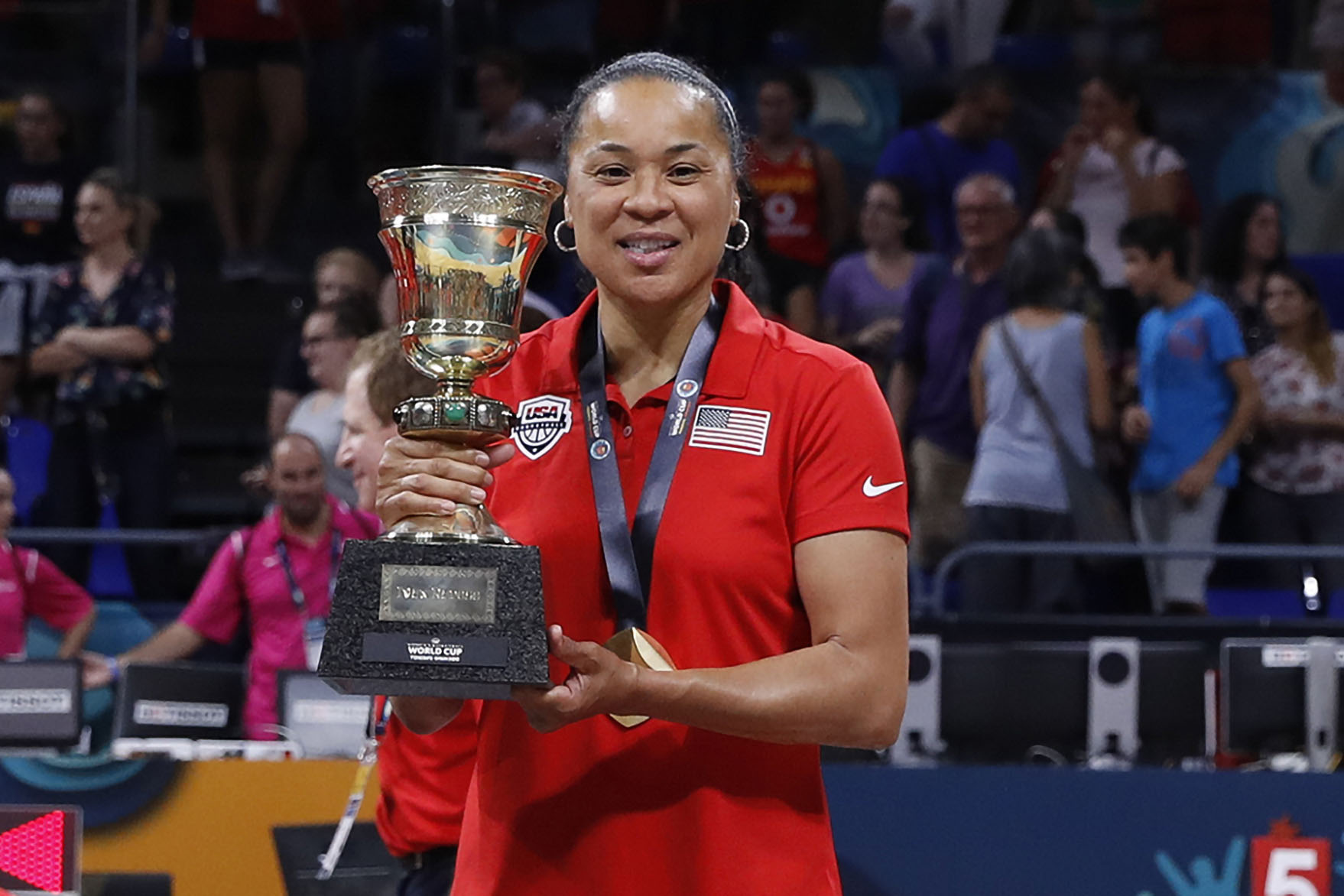 Dawn Staley holding world cup trophy