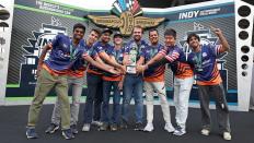 Group photo of the Cavalier Autonomous Racing team with their trophy at the Indianapolis Raceway