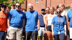 A group of volunteers gather to help move new students in 