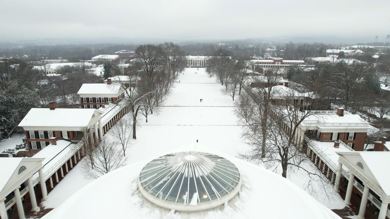 An aerial view of the snow covered Lawn from overtop the Rotunda 