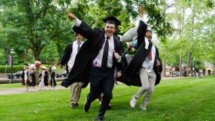 Graduates running and cheering during UVA‘s “Final Exercises 2025“