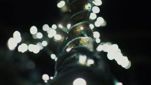 Lights wrapped around a railing at the Lawn