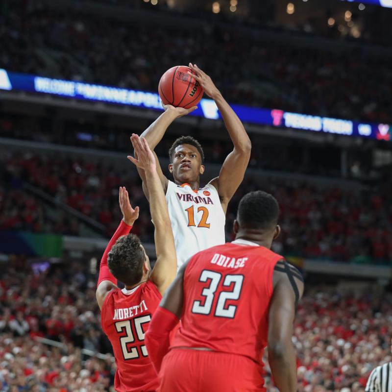 UVA basketball player shooting during a game