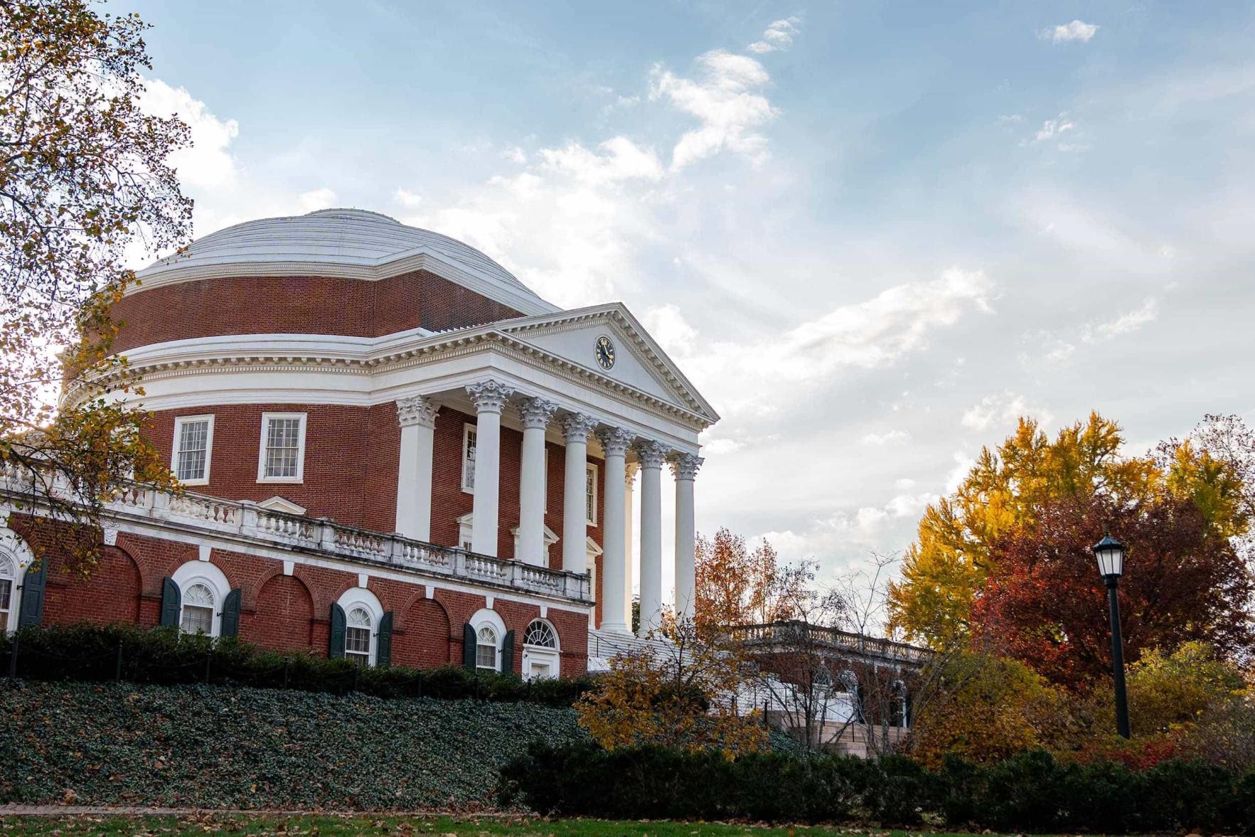 the UVA Rotunda from the Lawn below with an afternoon sky full of wispy clouds.