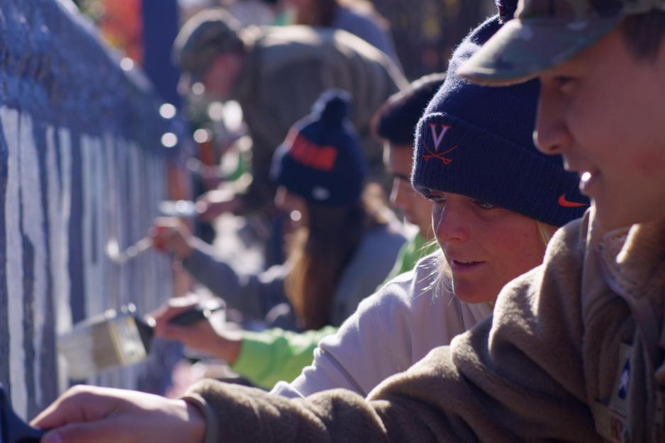 UVA students painting a bridge together