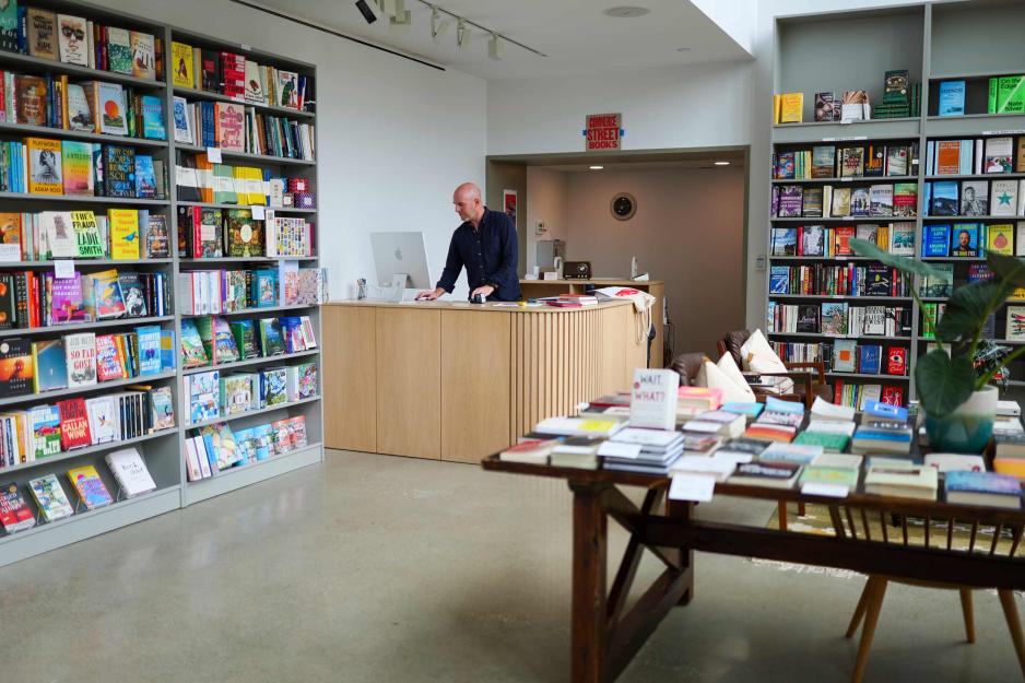 Philip Lorish at the counter of his bookstore ‘Commerce Street Books’