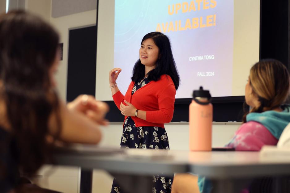 Cynthia Tong teaching in front of a class