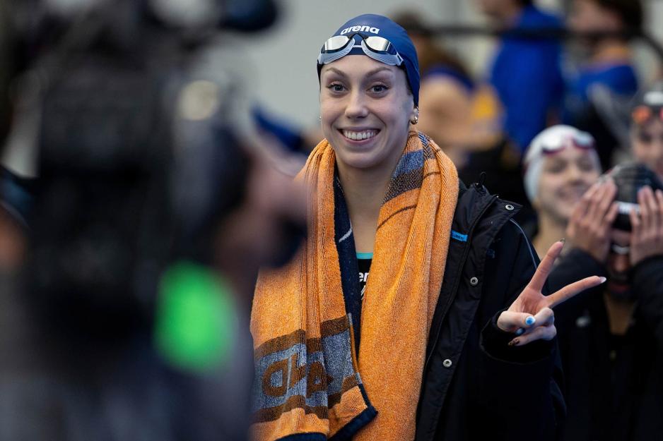 Gretchen Walsh after a swim meet looking and smiling at the camera