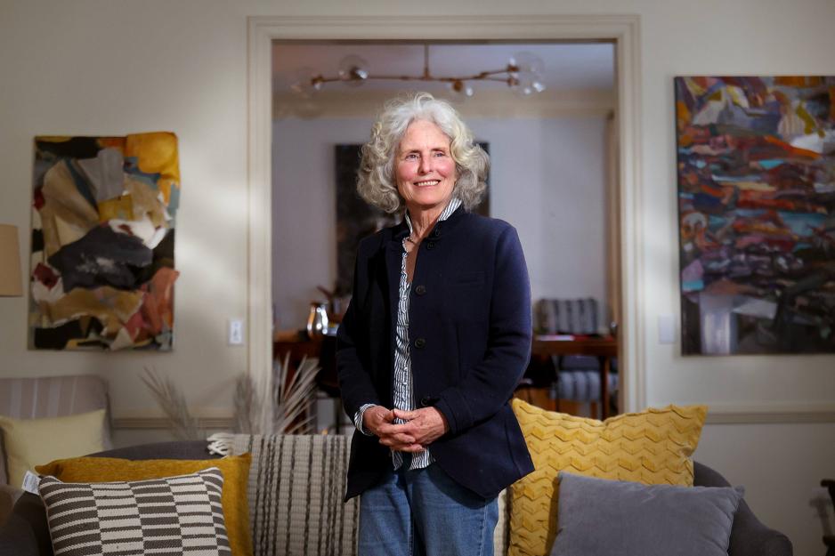 Mary Ann Parr, in her Charlottesville home, is framed by two pieces of her art. 