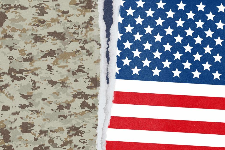 illustration of a camouflage pattern and the US flag being town apart from the center.