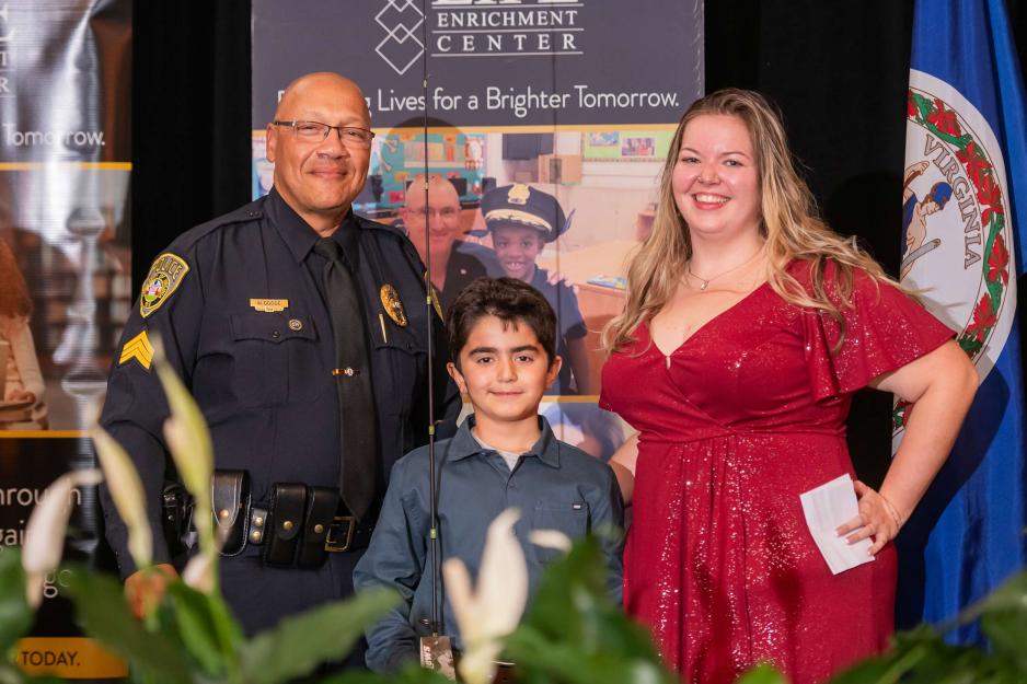 University Police Division Sgt. Wallace Goode, left, was honored for his exceptional dedication to his student mentee, Yasin Khalilov, center 