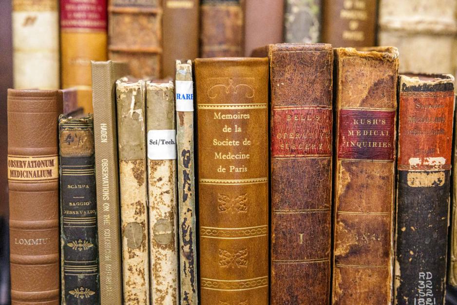 several old book spines covering topics in medicine