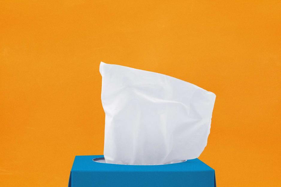 A box of tissues on an orange background