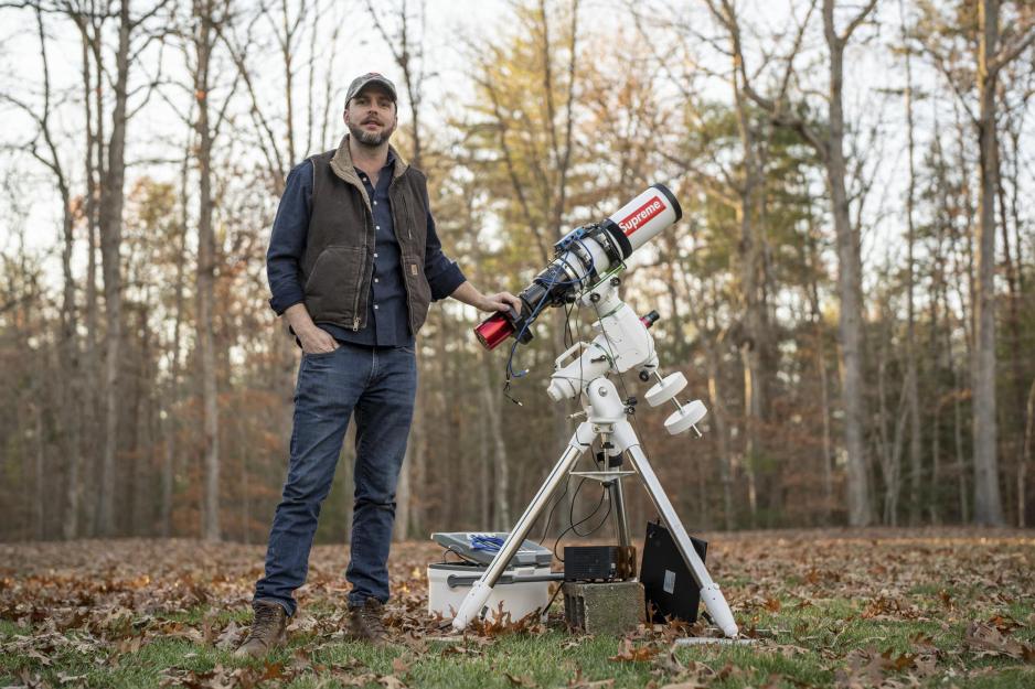 Brennan Gilmore with a telescope