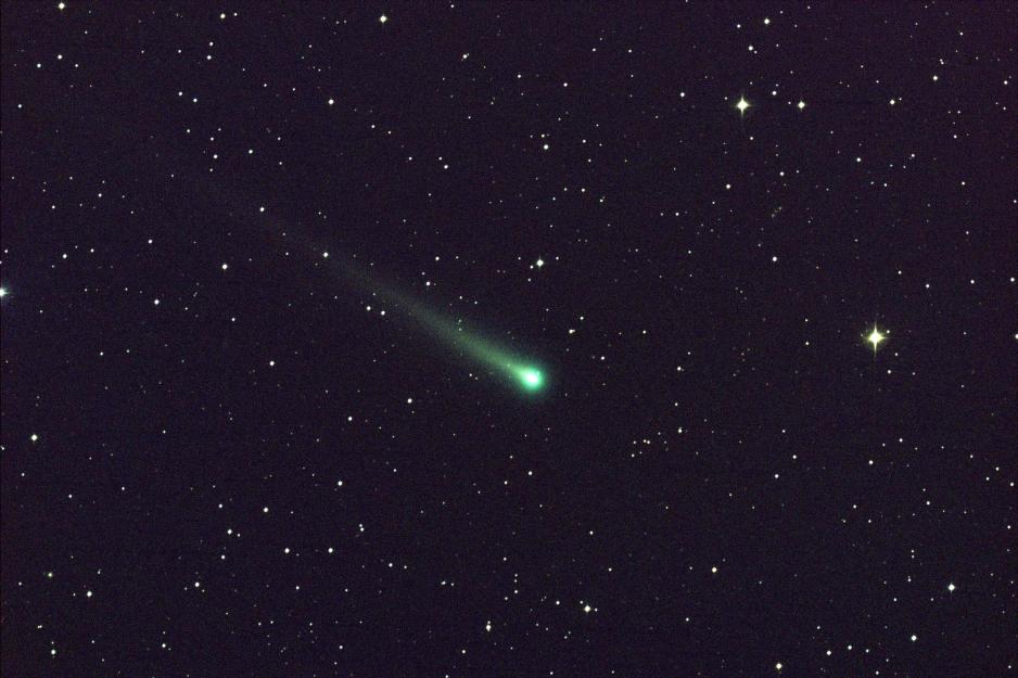 The comet ISON soaring across a star filled backdrop