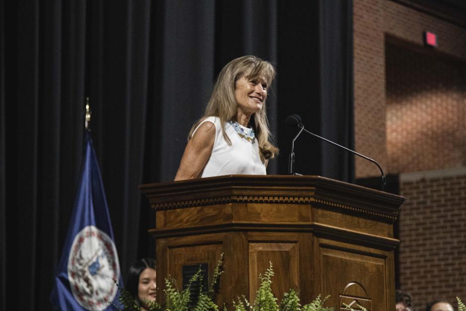Jacqueline Novogratz at the podium addressing the graduating class at Valediction 2023
