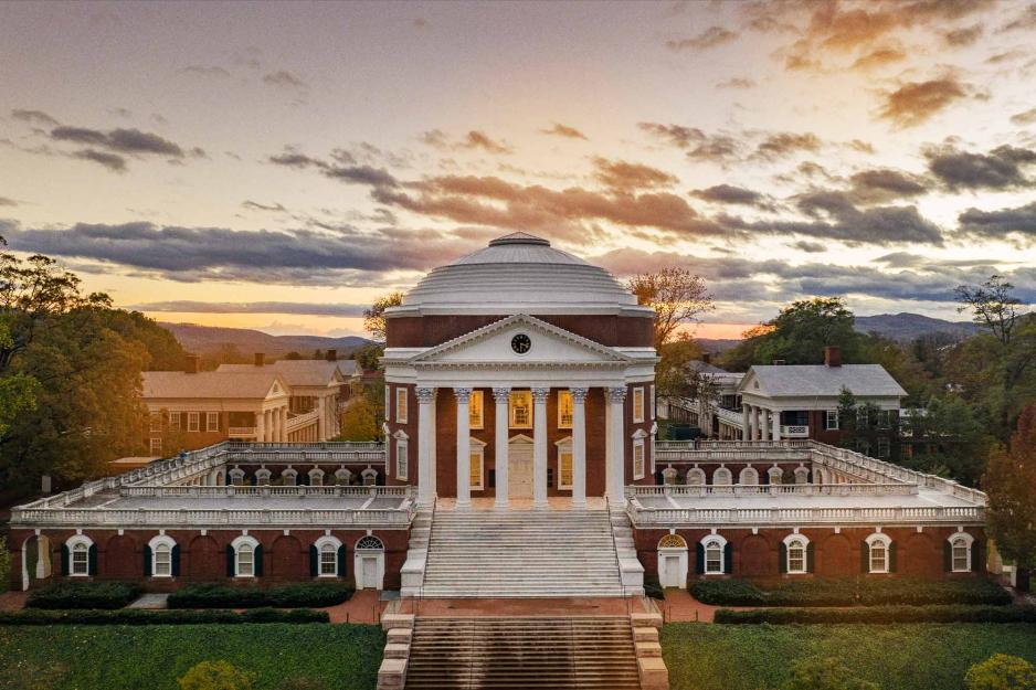 Aerial view of the Rotunda with storm clouds and a yellow sunset behind it