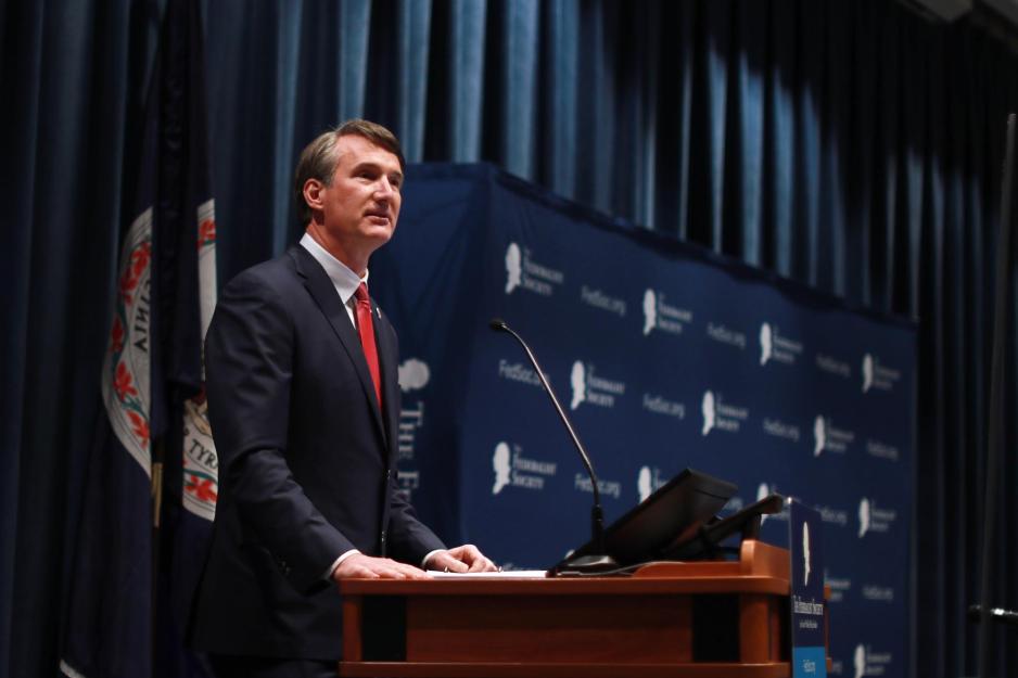 Governor Glenn Youngkin standing at a podium giving a speach