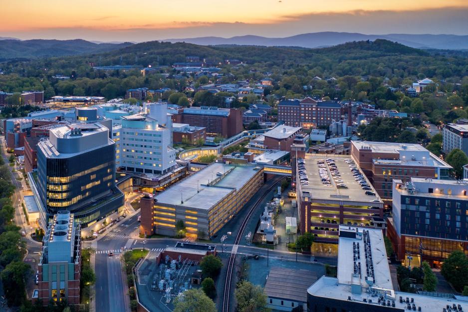 Aerial view of the UVA Health system with the Rotunda and the rest of Grounds visible in the distance