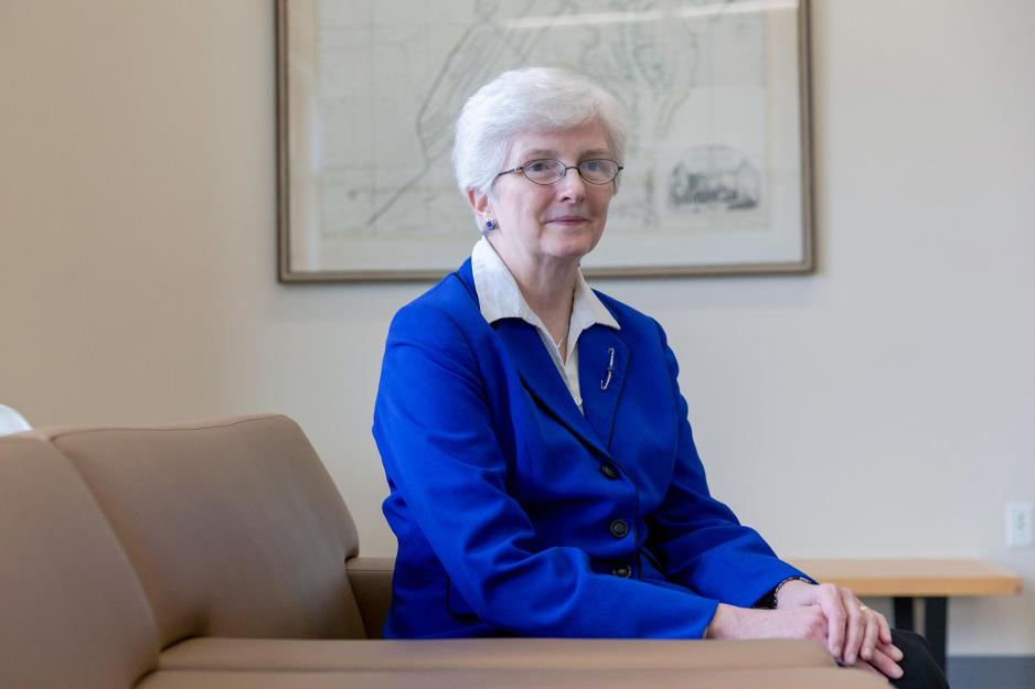 UVA professor of mathematics and history Karen Parshall, seated in a blue blazer