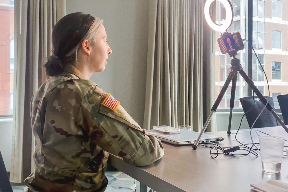 Lt. Col. Suzanne Cobleigh speaking to President Joe Biden through video chat