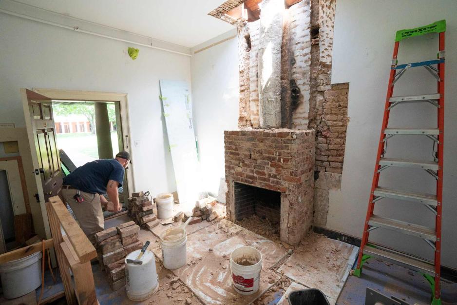 A ladder and various construction materials are strewn around the Lawn room as the chimney is reconstructed. 