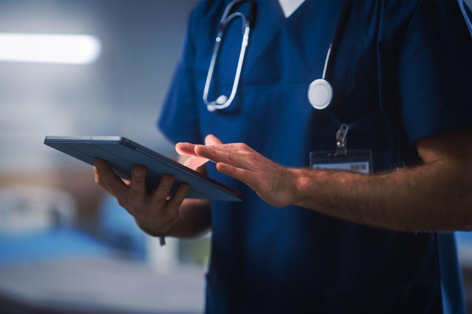 Nurse holding a tablet