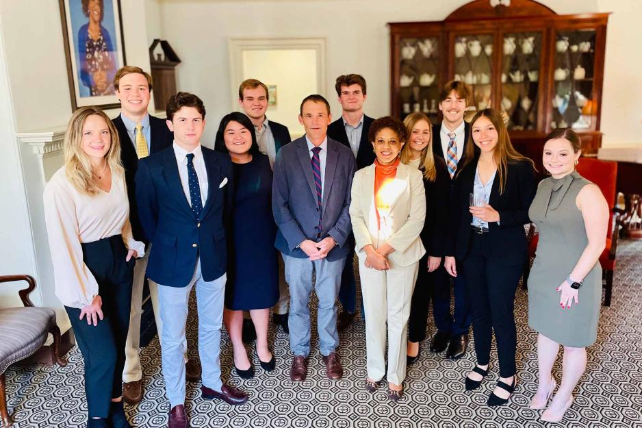 Group photo of Republican and Democrat students with President Jim Ryan.