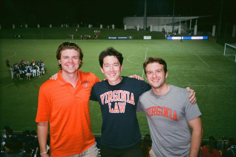 Portrait in front of soccer field of Paul Patton, Peter Lee Hamilton, and Chris Hamborksy 