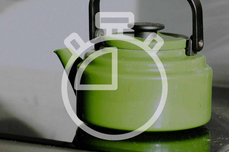 Green Tea Kettle with a Clocker overlaid on it