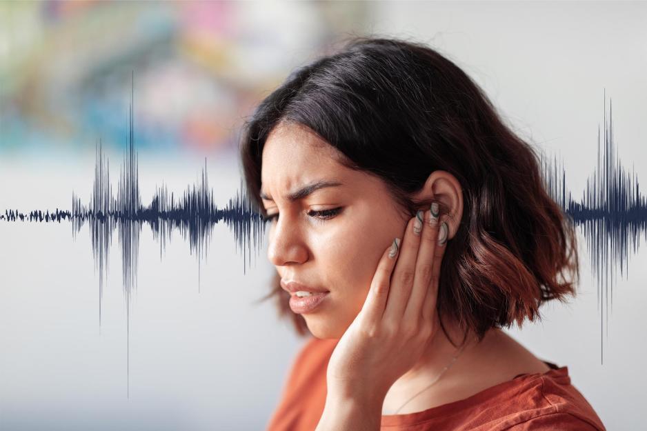 Woman covering her ear with a soundwave in the background of the photo