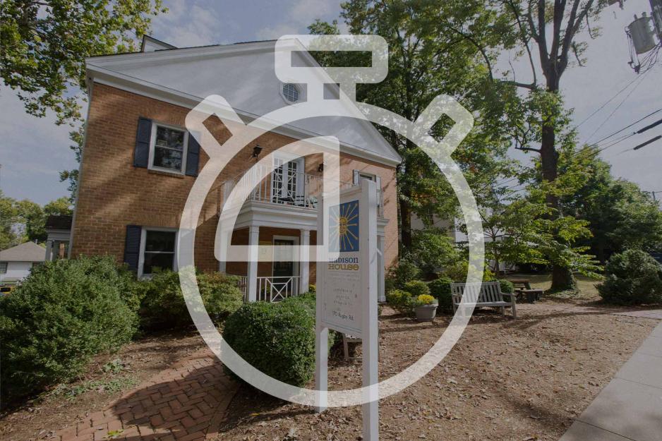 Illustration of a stop watch over a photo of Madison House